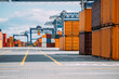 © Sky-Blue Images/Stocksy - Containers in import and export area at port.