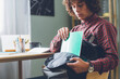 © Lumina/Stocksy - Student Packing His Bag