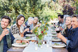 © Trinette Reed/Stocksy - Group of friends enjoying a Farm To Table Dinner Party