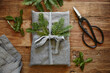 © Trinette Reed/Stocksy - Still life of homemade linen wrapped christmas present