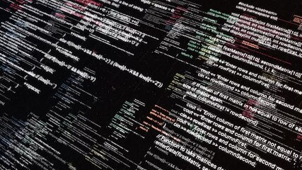 Abstract symbols flying diagonally on black screen background. Animation. Computer program codes running in a scrolling motion on a PC monitor display.