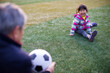 © Bo Bo/Stocksy - Happy Little Girl Playing with her Grandfather outdoor in the fo