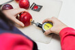 © Luis Cerdeira/Stocksy - Technician measuring fruit firmness with a penetrometer