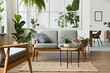 © FollowTheFlow - Modern scandinavian interior of living room with design grey sofa, armchair, a lot of plants, coffee table, carpet and personal accessories in cozy home decor. Template.