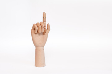 wooden hand index finger up on a white background.