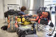 © Ibex.media/Stocksy - Traveler sitting down with his luggage and reading a book