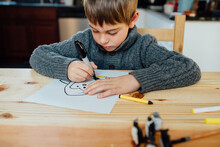 Boy Drawing Penguin