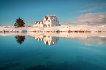 Wall Mural - Typical view of turf-top houses in Icelandic countryside. Dramatic summer sunrise in Reykjavik, Iceland, Europe. Traveling concept background.
Lonely house with red roof on the sea coast. 