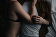 © Jess Craven/Stocksy - Young attractive couple intimate cuddling in bed