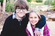 © Leigh Love/Stocksy - Brother & Sister Pose for Holiday Photos