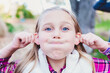 © Leigh Love/Stocksy - Blonde Haired Tween Girl Making A Funny Face