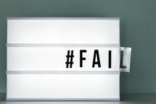 Lightbox With The Word Fail Falling Out