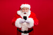 © deagreez - Portrait of his he nice attractive handsome amazed stunned Santa using gadget 5g fast speed blog blogger browsing multimedia isolated over bright vivid shine vibrant red color background
