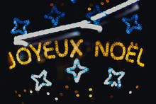 Joyeux Noel, Merry Christmas In French In Blurred Lights