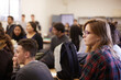 © MIQUEL LLONCH/Stocksy - Group of students paying attention to the speaking in a classroom