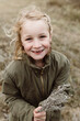 © Carey Shaw/Stocksy - Outdoor portrait of cute girl smiling