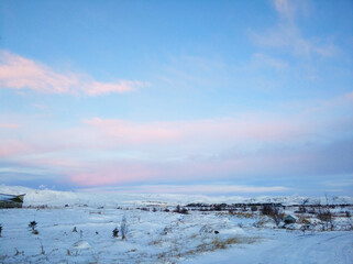 Wall Mural - Iceland's incredible fields and plains landscape in winter. The ground is covered with snow. Large spaces. The beauty of winter nature