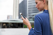 © Jovo Jovanovic/Stocksy - Modern business woman reading a text message on her phone