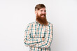 © luismolinero - Redhead man with long beard over isolated white background happy and smiling