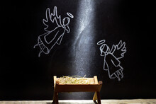 Birth Of Jesus, Manger And Angels On Blackboard Abstract Christmas Nativity Scene