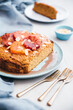 © Ina Peters Photographie/Stocksy - Food: Vegan cake with cornmeal, almond flour, tangerines and blo