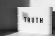 © Helen Rushbrook/Stocksy - Lightbox with the word Truth
