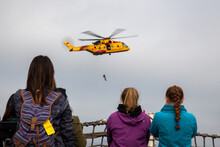 While Onboard A Warship From The Canadian Forces Base In Esquimalt, British Columbia, A Group Of Women Watch A Search And Rescue Demonstration Of A CH-149 Cormorant Search And Rescue Aircraft.