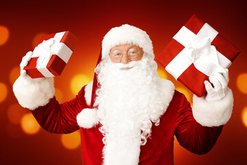 Poster - Santa Claus with gifts on color background