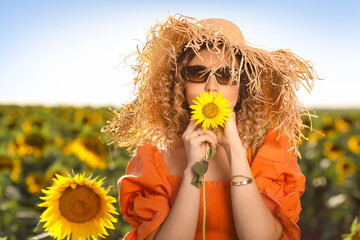 Sticker - Beautiful young woman in sunflower field