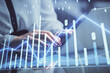 © peshkova - Double exposure of businesswoman hands typing on computer and forex chart hologram drawing. Financial analysis concept.