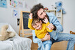 © Guille Faingold/Stocksy - Funny father playing with kid.
