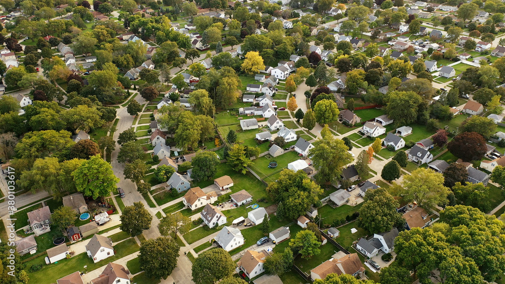 Aerial drone view of American suburban neighborhood. Establishing shot of America's  suburb. Residential single family houses pattern. Autumn Fall season - obrazy, fototapety, plakaty 