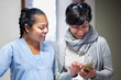 © Per Swantesson/Stocksy - Medical professional and patient sharing information on cell phone