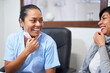 © Per Swantesson/Stocksy - Friendly dentist enjoying herself with a smiling patient