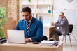 © Elnur - Two male colleagues working in the office