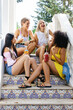 © BONNINSTUDIO/Stocksy - Group of friends hanging out at home on a summer day.