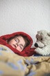 © Mima Foto/Stocksy - Preschooler taking nap after a bath