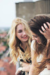 © Jovana Rikalo/Stocksy - Two female friends is laughing