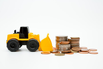 Wall Mural - Model loader, coins stack on white background  for money saving concept