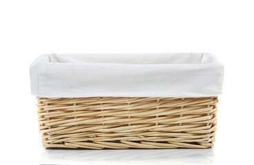 Empty straw basket isolated on white.