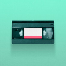 VHS Video Tape Cassette Isolated On Blue Background, Pop Art Design, Close Up