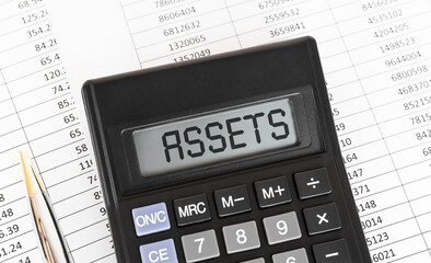 Calculator with the word Assets on the display