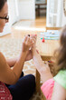 © Jakob Lagerstedt/Stocksy - Cute toddler getting her toes painted