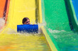 © Jovana Milanko/Stocksy - Little girl being afraid of water slide