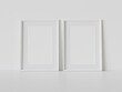 Two white frames leaning on white floor in interior mockup. Template of pictures framed on a wall 3D rendering