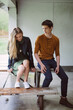 © Gabrielle Lutze/Stocksy - Boy and Girl Sitting on a Picnic Bench out of the Rain