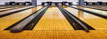 Bowling Wooden Floor With Lane, Generic Bowling Alley Lanes With Bowling Ball Going Towards The Pins.