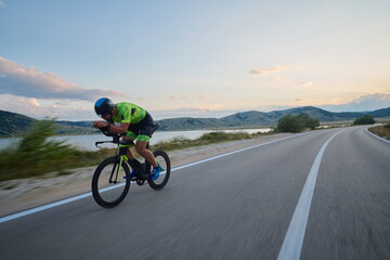 Wall Mural - triathlon athlete riding bike