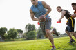 © aaronbelford inc/Stocksy - Flag Football Player Run