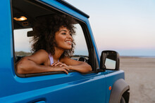 Image Of Cheerful African American Woman Smiling While Travelling In Car